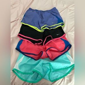 4 Pairs Nike drawstring running’s shorts: black, purple, teal, pink